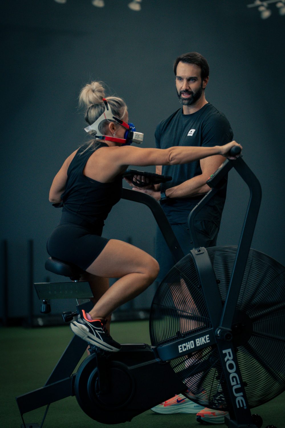 Client on the bike mid-test while Dr. Troha monitors