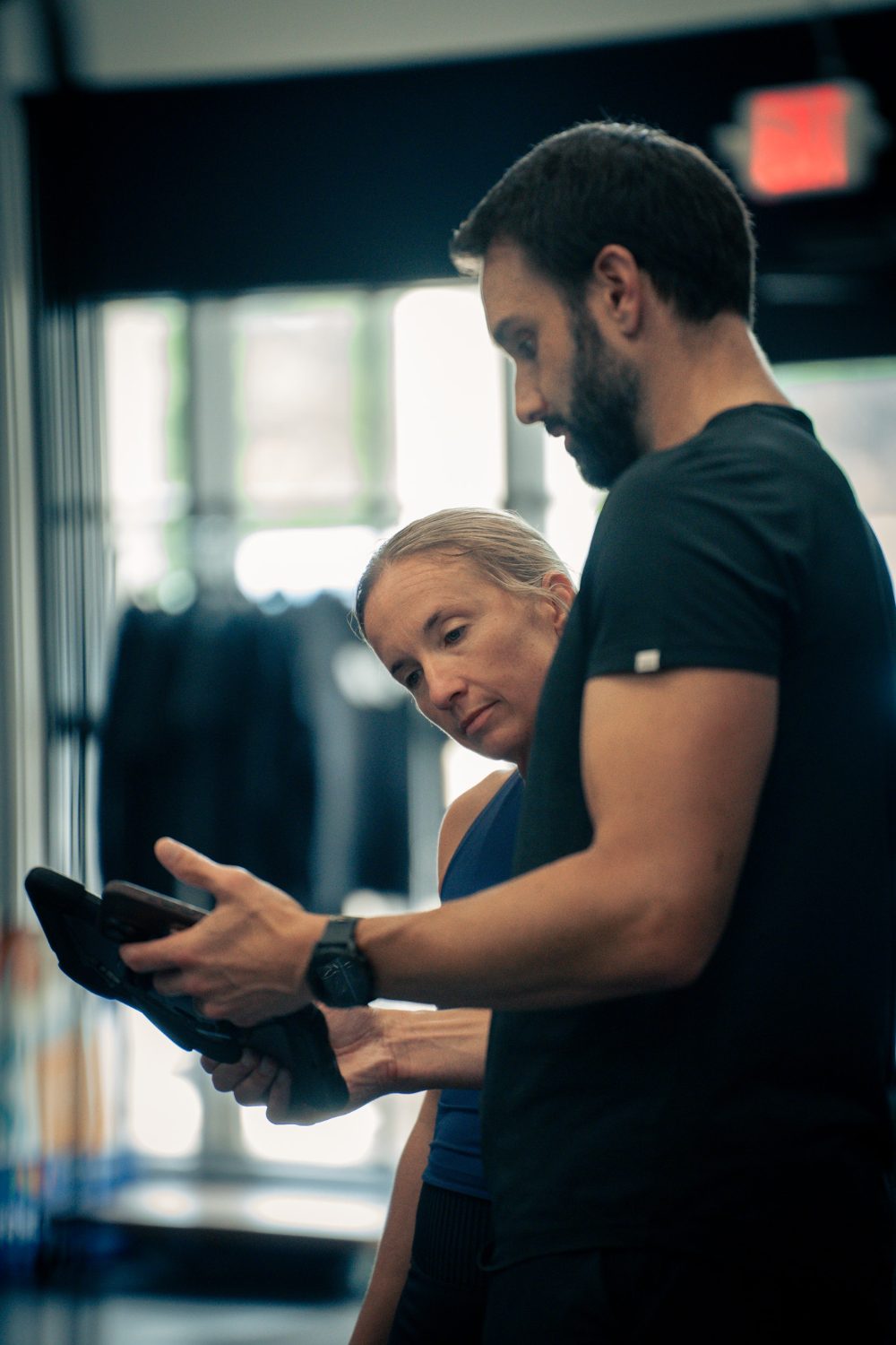 Dr. Troha walking a client through her results on the tablet